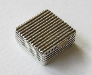 A Continental square pill box with hinged lid marked 825