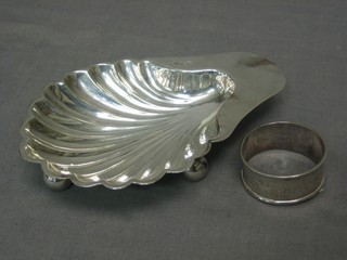 A Victorian scallop shaped silver butter dish, Sheffield 1897 by Mappin & Webb, together with a silver napkin ring, 3 ozs