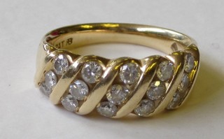 An 18ct gold dress ring set 5 diagonal rows of 3 diamonds
