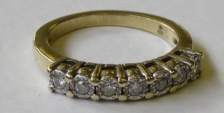 A gold dress ring set 7 diamonds