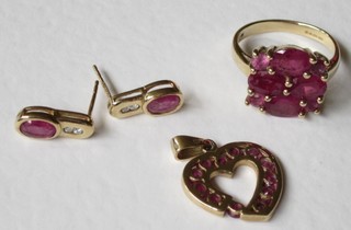 A suite of 9ct gold jewellery set rubies, comprising  ring, heart shaped pendant and a pair of earrings