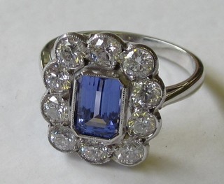 A lady's 18ct white gold dress ring set a square cut tanzanite supported by diamonds, approx 1.40/1.35ct
