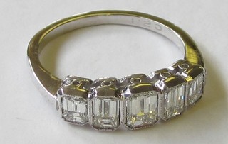 A lady's 18ct white gold engagement/dress ring set 5 emerald cut diamonds approx. 1.20ct