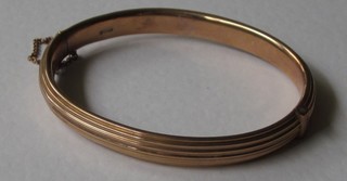 A 9ct hollow gold bangle