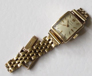 A lady's Girard Perregaux wristwatch, contained in a 9ct gold case with integral bracelet