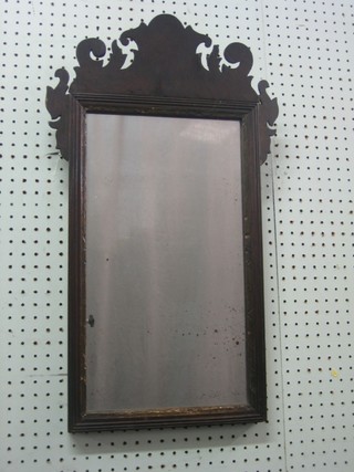 A 19th Century Chippendale style plate mirror contained in an oak frame 26"