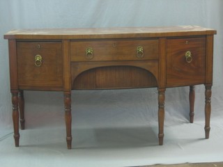 A Regency mahogany bow front sideboard fitted 1 long drawer flanked by a 2 deep drawers, raised on turned supports 66"