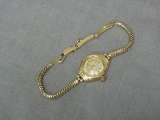 A lady's Rotary wristwatch contained in a 9ct gold case with integral bracelet