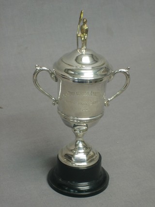 A silver twin handled rowing cup, the finial in the form of a silver gilt oarsman, London 1927 4 ozs