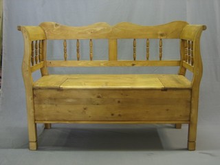 A Continental stripped and polished pine settle 50"