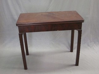 A Georgian mahogany rectangular card table, raised on square supports 33"