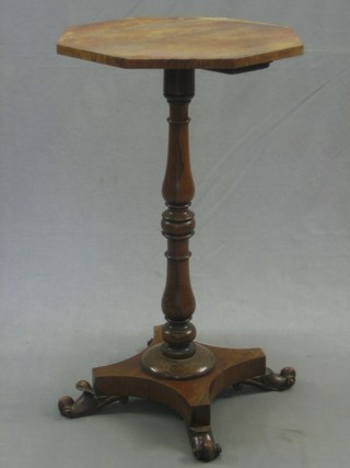 A William IV octagonal rosewood wine table raised on a turned column with triform base, 17"