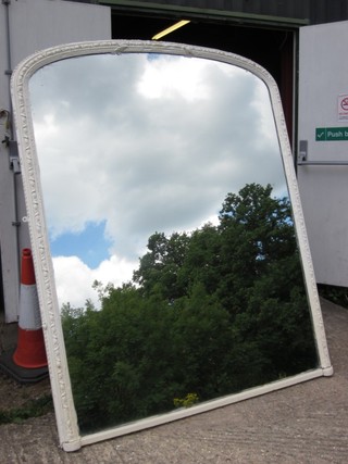 A Victorian arched plate over mantel mirror contained in a white painted frame 73" x 58"