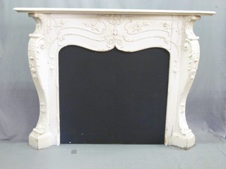 A handsome carved wooden fire surround 68"