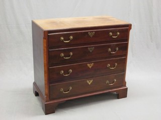 A Georgian mahogany chest with canted corners and 4 long drawers with brass swan neck drop handles, raised on bracket feet 32"