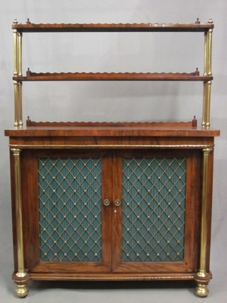A handsome Regency rosewood chiffonier, the raised back with brass columns, the base fitted a cupboard enclosed by a grilled panelled door with brass columns to the side 42"