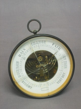 An aneroid barometer and thermometer contained in a brass drum case 5" (glass f)