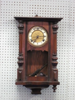 A Vienna style small striking regulator with 5 1/2" paper dial contained in a walnut case 18" (glass broken, no weights)