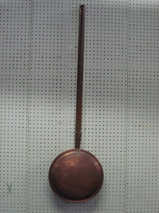 A 19th Century copper warming pan with turned wooden handle