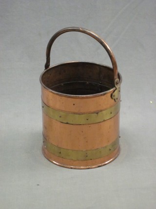 A circular copper and brassed coal bucket 11"