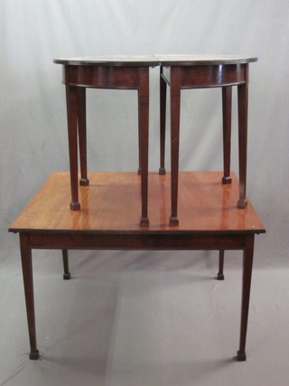 A Georgian style mahogany D end dining table with centre section, raised on square tapering supports