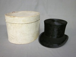 A gentleman's black silk top hat, complete with cardboard box