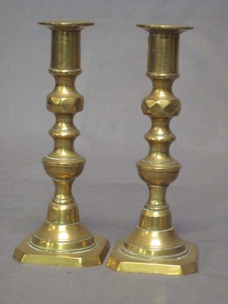 A pair of 19th Century brass candlesticks with knopped stems 7"