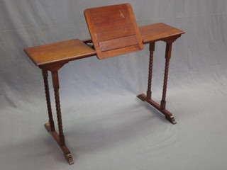 A Victorian rectangular mahogany folding reading table, raised on bobbin turned supports 39"