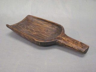 A wooden grain scoop 14"