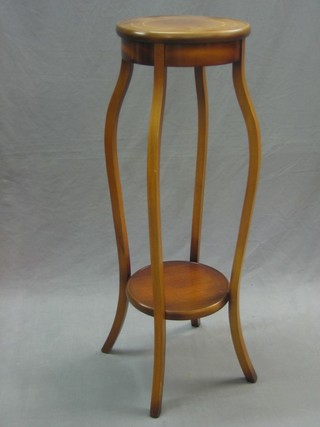 An Edwardian circular inlaid mahogany 2 tier jardiniere stand, raised on cabriole supports 12"