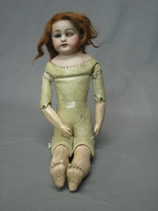 A 19th Century porcelain headed doll with open and shutting eyes, leather covered body, articulated limbs and composite legs