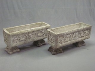 A good pair of rectangular cast concrete garden planters with swag decoration, raised on bun supports 31"