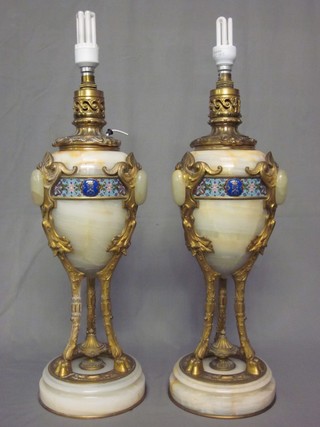 A handsome pair of 19th Century French gilt ormolu and polished onyx oil lamp reservoirs with champe leve enamelled banding, decorated an Earls cipher with coronet, (sympathetically converted for use as electric table lamps) 23"