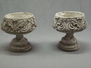 A pair of circular concrete garden urns with cast swag decoration 15"