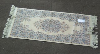 A grey ground machine made floral patterned Persian style rug 46" x 24"