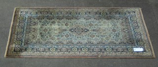 A Persian style pink ground rug (some wear) 63" x 35"