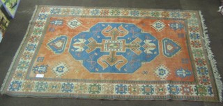 A Caucasian style rug with blue and tan ground 113" x 75"