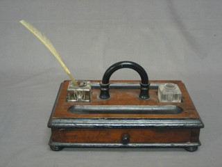 A Victorian rectangular mahogany standish fitted 2 pen recepticals and 2 inkwells, the base fitted a drawer