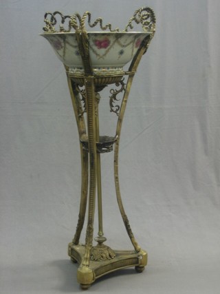 A reproduction Victorian gilt metal and porcelain wash stand fitted a floral patterned bowl