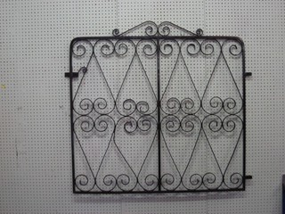 A pair of wrought iron garden gates 80"