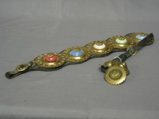 A leather Martingale hung 5 horse brasses