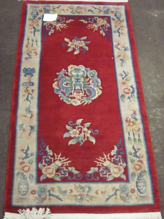 A red ground Chinese runner decorated a dragon 72" x 36"