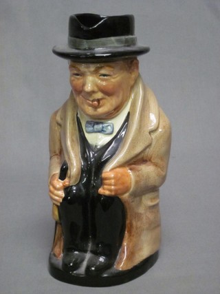 A Royal Doulton character jug in the form of a seated Sir Winston Churchill, the base impressed 8360 9"