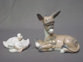 A Nao figure of a seated Donkey 4" and a Nao figure of 2 Ducklings 4"