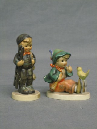 A Goebel figure - Chimney Sweep (f and r) and 1 other in the form of a seated figure of a boy with bird (f and r)