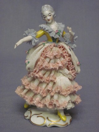 A 20th Century Dresden porcelain figure of a Crinoline lady (fingers f), based cracked and marked 1612 Dresden 5"