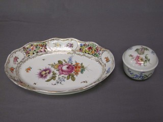 A "Meissen" boat shaped pierced porcelain bowl with floral decoration, the base impressed 104P 11" together with a circular Meissen porcelain jar and cover with floral decoration 3"