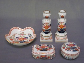 A Meissen 5 piece dressing table set comprising pair of candlesticks 5 1/2" (some chips to rim), rectangular trinket box 3 1/2", cylindrical trinket box 3 1/2" and circular bowl 5 1/2"