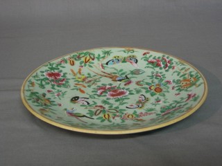 An Oriental green glazed plate the reverse with seal mark 10"