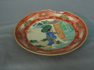 An Oriental circular plate decorated a gentleman carrying a bale, the reverse with 6 character mark 8" (large chip)